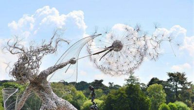 植物園不銹鋼抽象人物和蒲公英雕塑